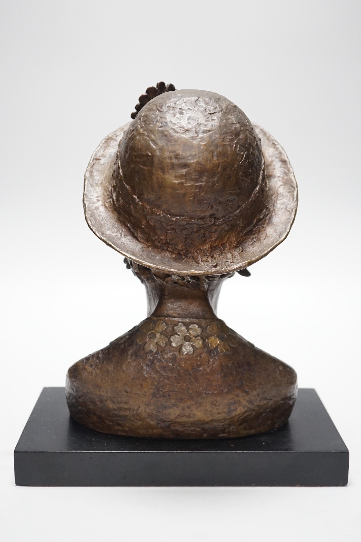 A bronze portrait bust, believed to be film director's wife, Mo Endfield, 27cms high